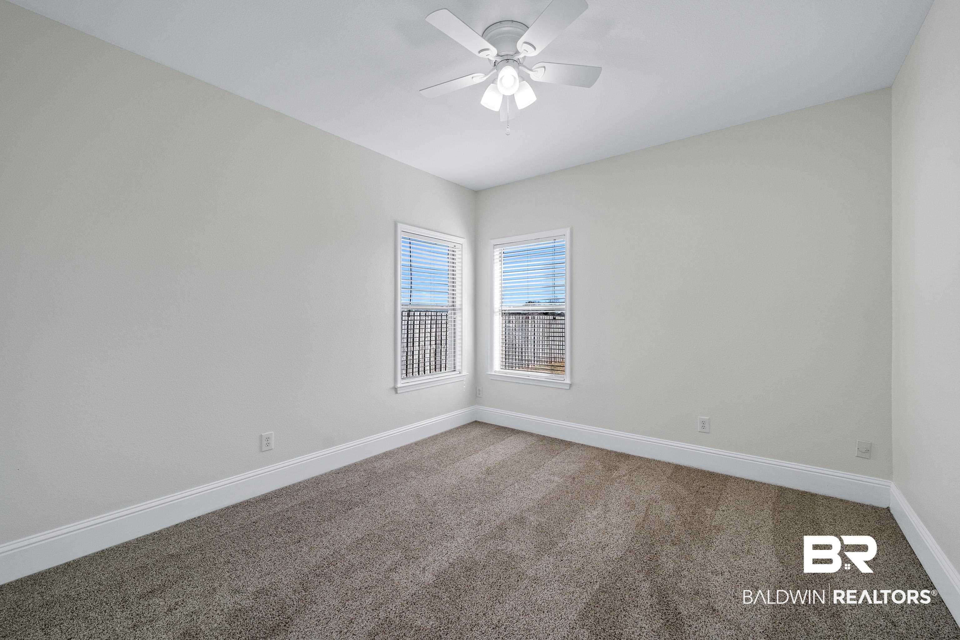 25350 Spindle Lane Daphne, AL 36526 - Photo 24 of 32 Carpeted spare room featuring ceiling fan