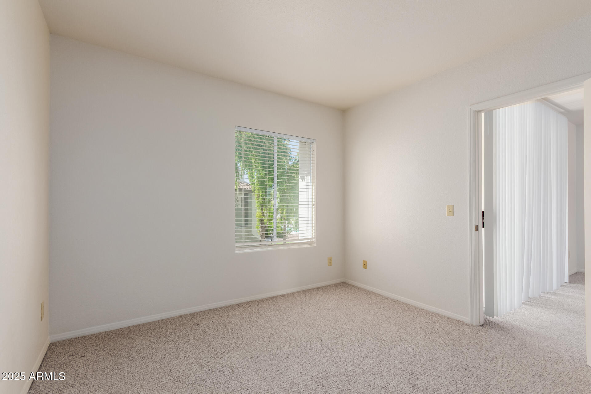 1825 West Ray Road, Unit 2070 Chandler, AZ 85224 - Photo 16 of 51 an empty room with windows