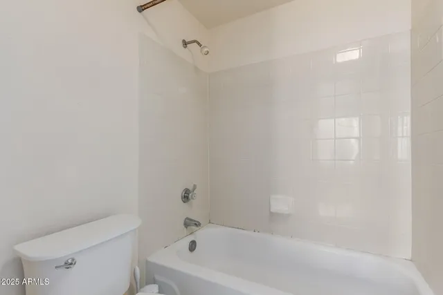 a bathroom with a shower sink vanity and mirror