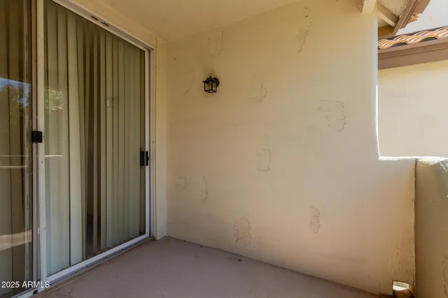 a view of a house with backyard and a tree