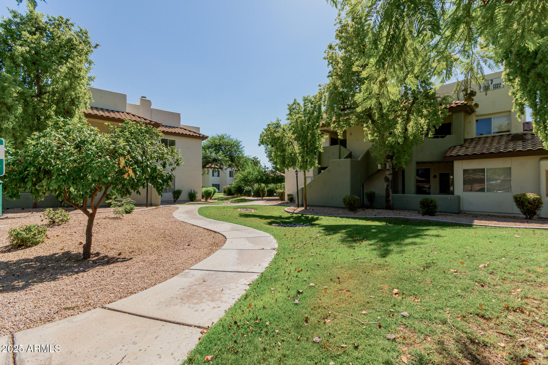 1825 West Ray Road, Unit 2070 Chandler, AZ 85224 - Photo 26 of 51 a view of a house with backyard and a tree