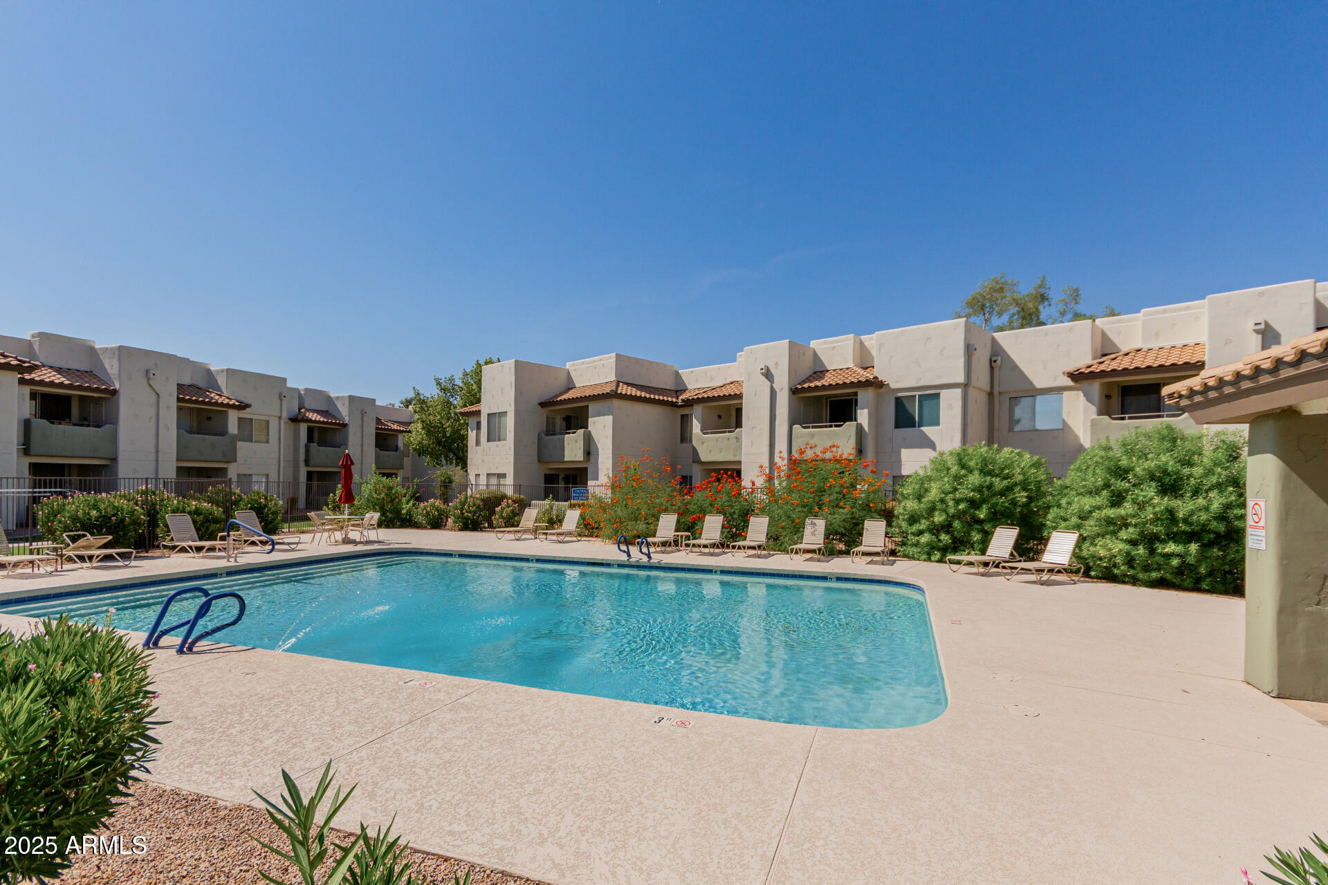 1825 West Ray Road, Unit 2070 Chandler, AZ 85224 - Photo 29 of 51 a view of a house with swimming pool