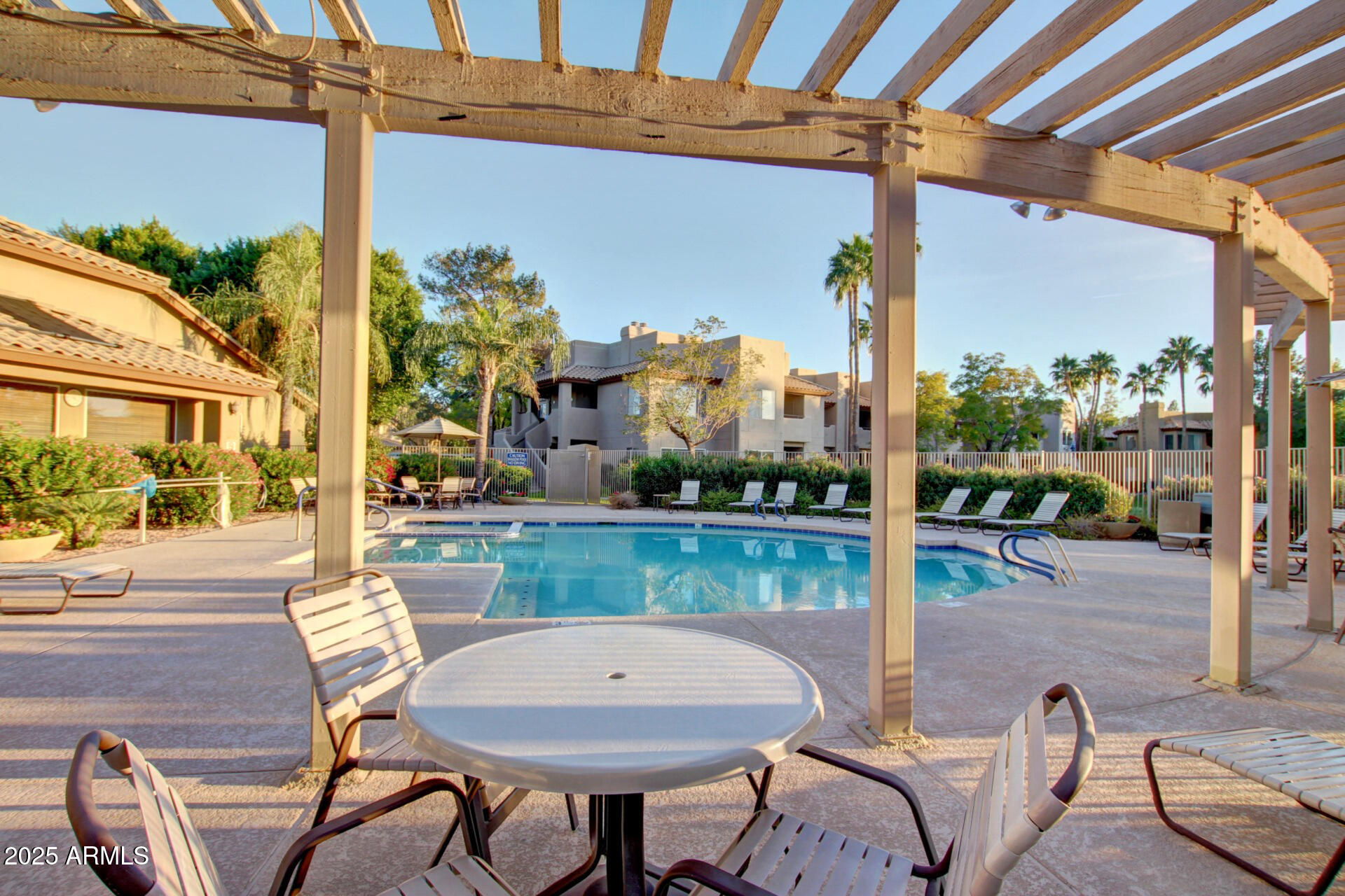 1825 West Ray Road, Unit 2070 Chandler, AZ 85224 - Photo 32 of 51 a view of a patio with a table chairs and a patio