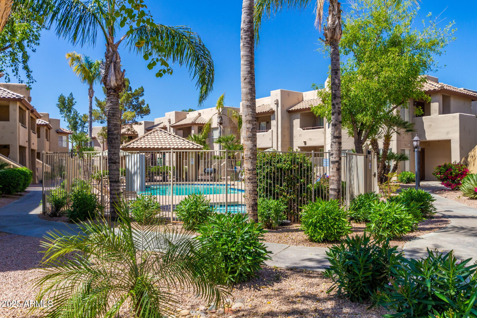 1825 West Ray Road, Unit 2070 Chandler, AZ 85224 - Photo 36 of 51 a front view of a house with a yard