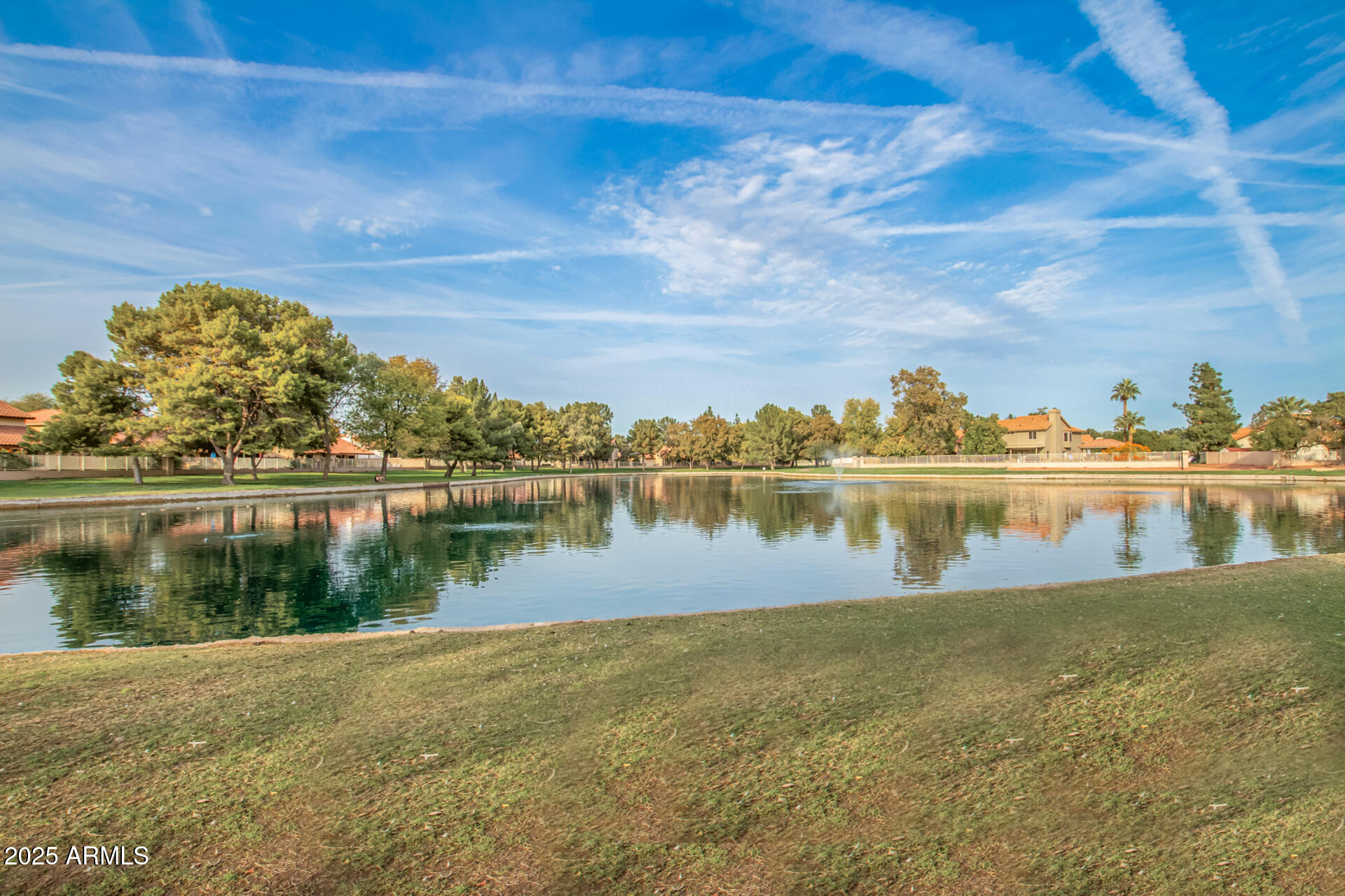 1825 West Ray Road, Unit 2070 Chandler, AZ 85224 - Photo 41 of 51 a view of a lake with a yard