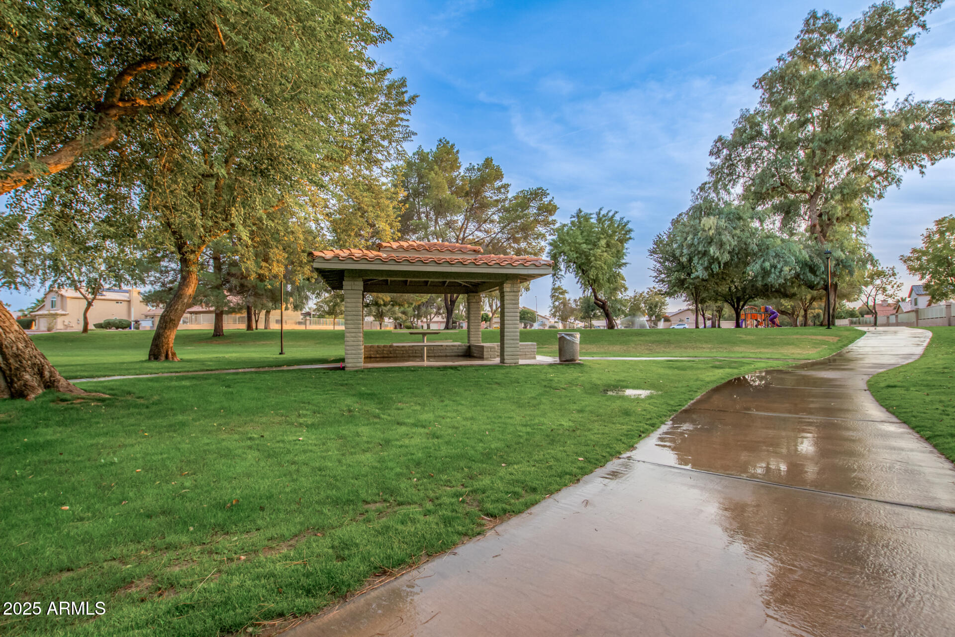 1825 West Ray Road, Unit 2070 Chandler, AZ 85224 - Photo 51 of 51 a view of a park with large trees and a pathway