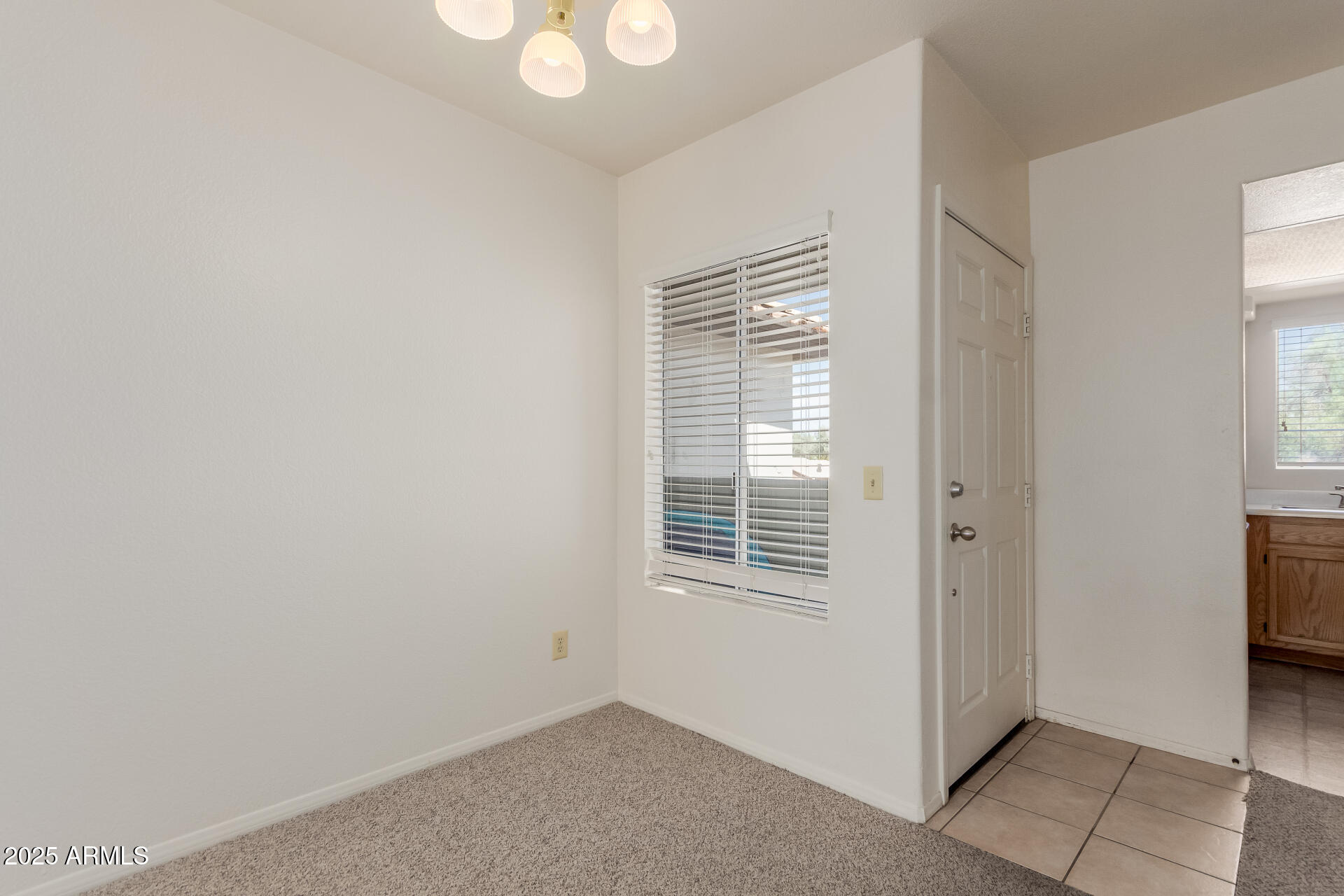 1825 West Ray Road, Unit 2070 Chandler, AZ 85224 - Photo 7 of 51 a view of an empty room with a window