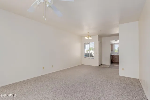 an empty room with a empty space and windows