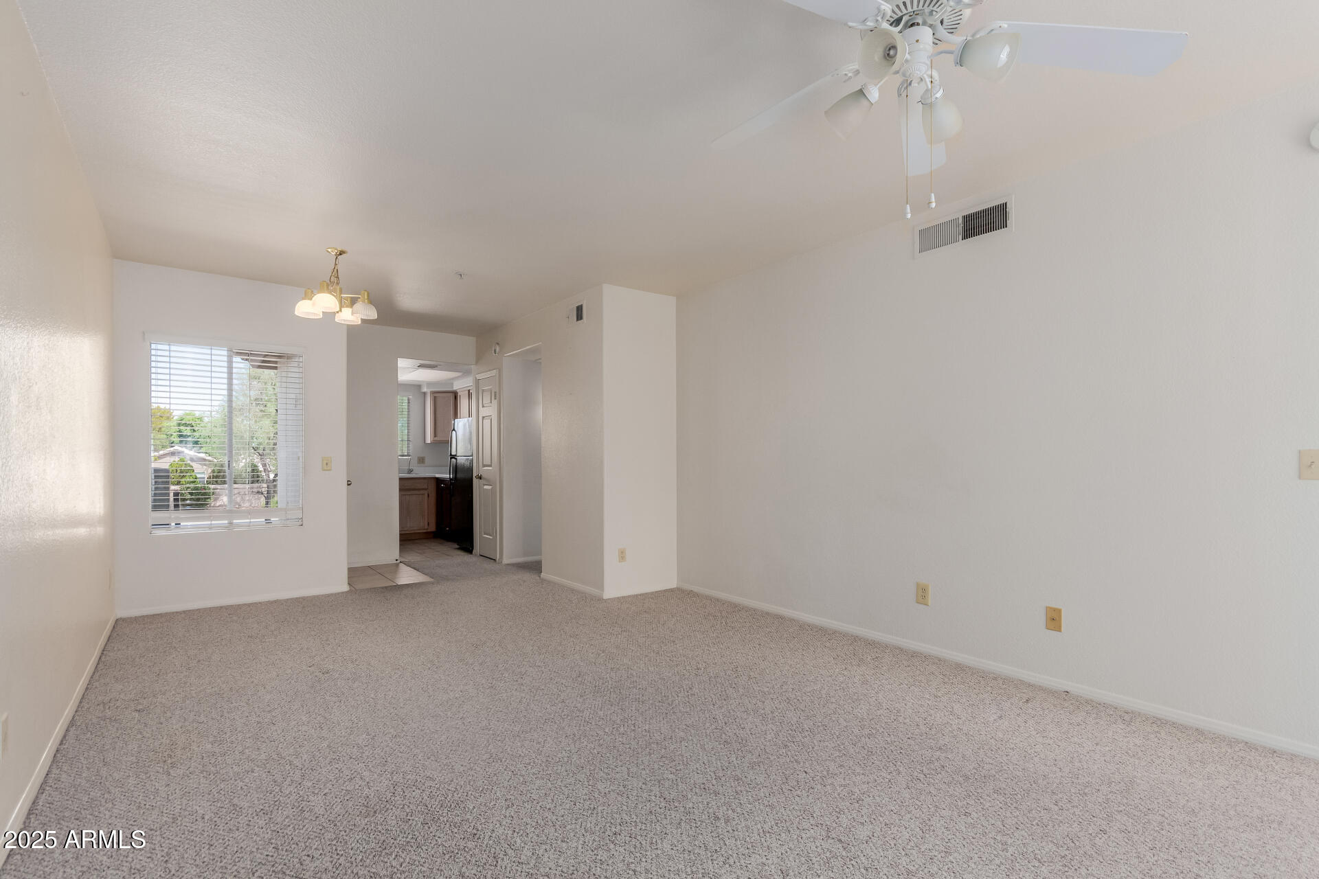 1825 West Ray Road, Unit 2070 Chandler, AZ 85224 - Photo 9 of 51 an empty room with a empty space and windows