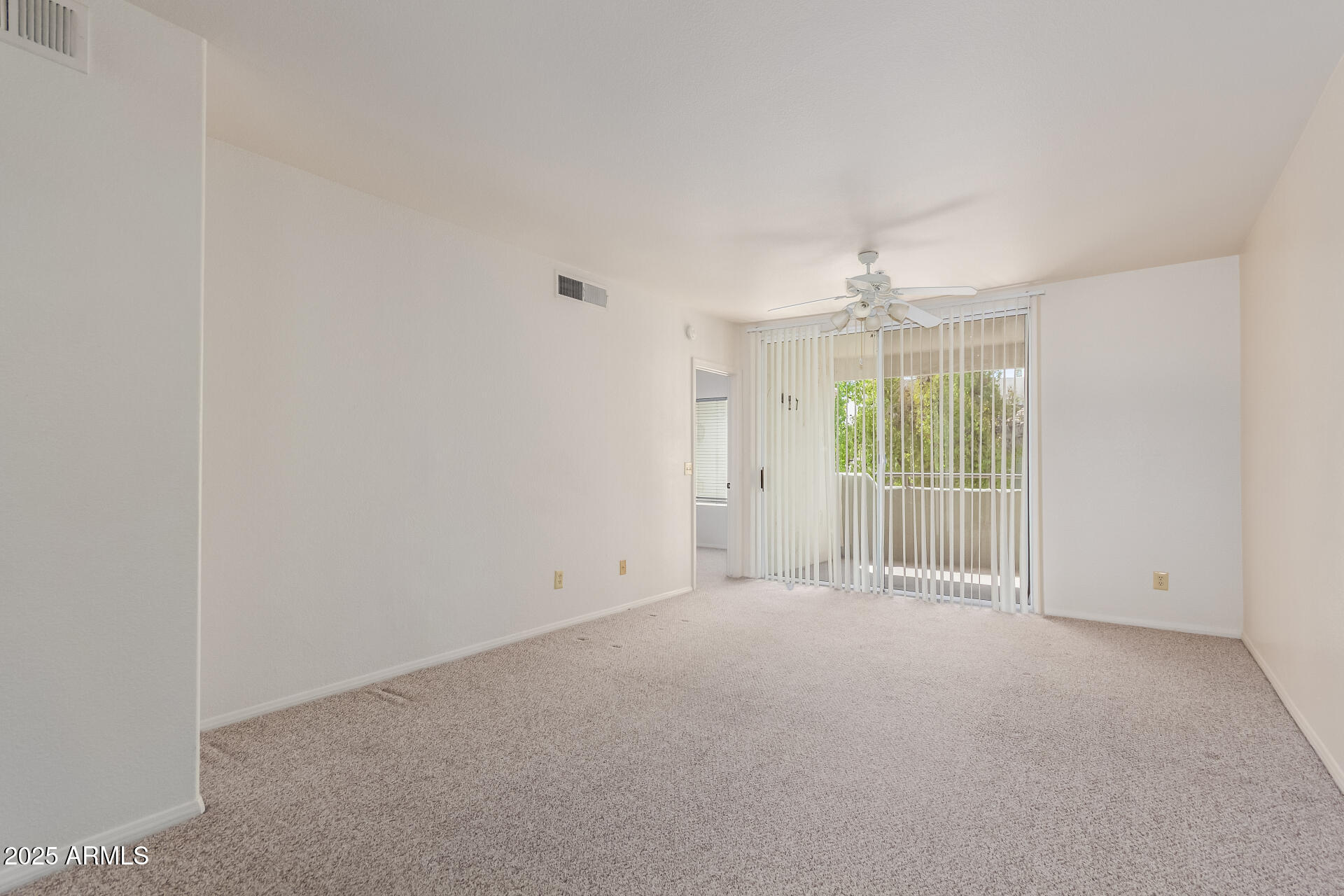 1825 West Ray Road, Unit 2070 Chandler, AZ 85224 - Photo 10 of 51 a view of an empty room with a window