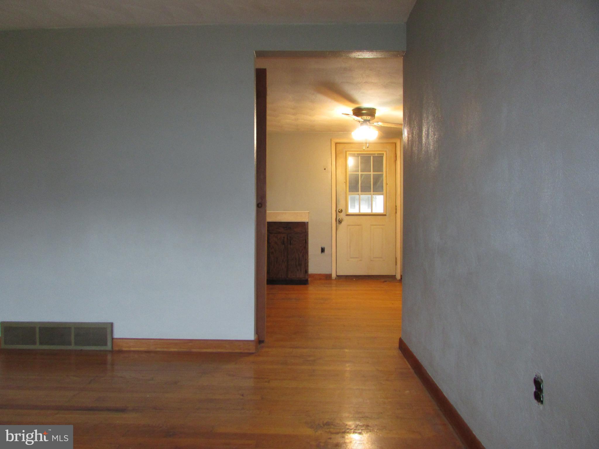 270 Rosedale Drive Manchester, PA 17345 - Photo 3 of 15 a view of empty room with wooden floor and fan