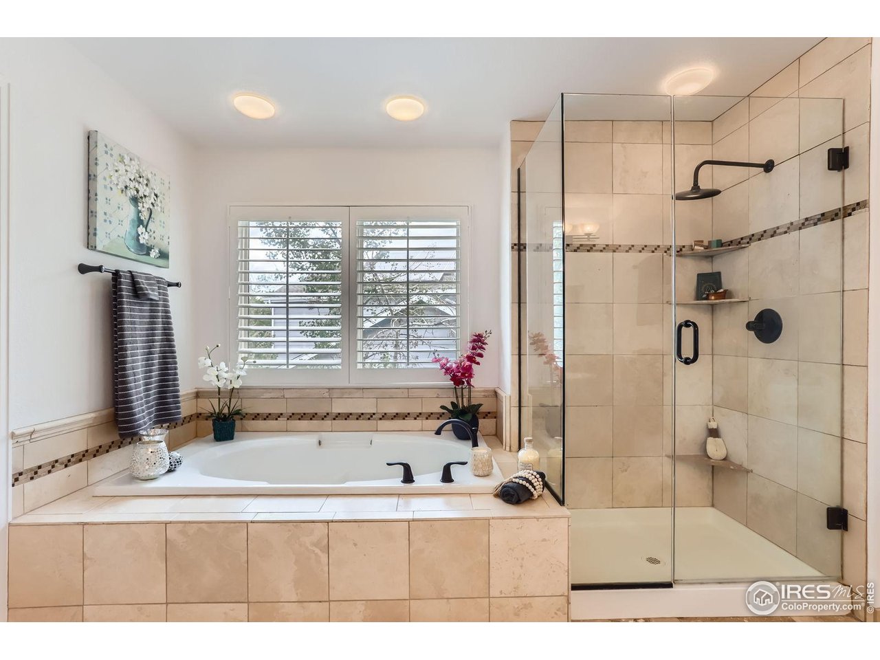 1069 Monarch Way Superior, CO 80027 - Photo 20 of 40 a bathroom with a tub sink and mirror