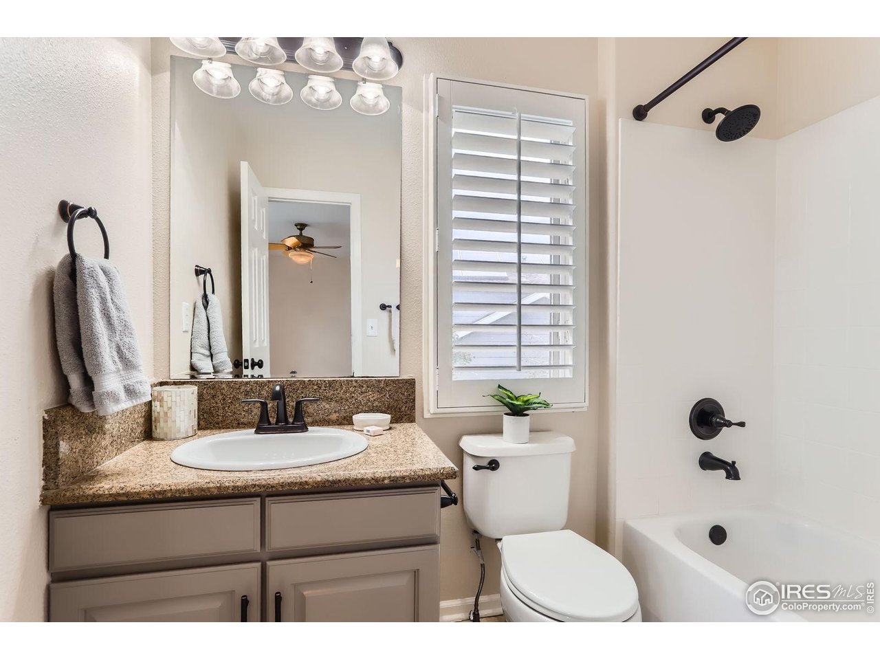 1069 Monarch Way Superior, CO 80027 - Photo 23 of 40 a bathroom with a sink a toilet and shower