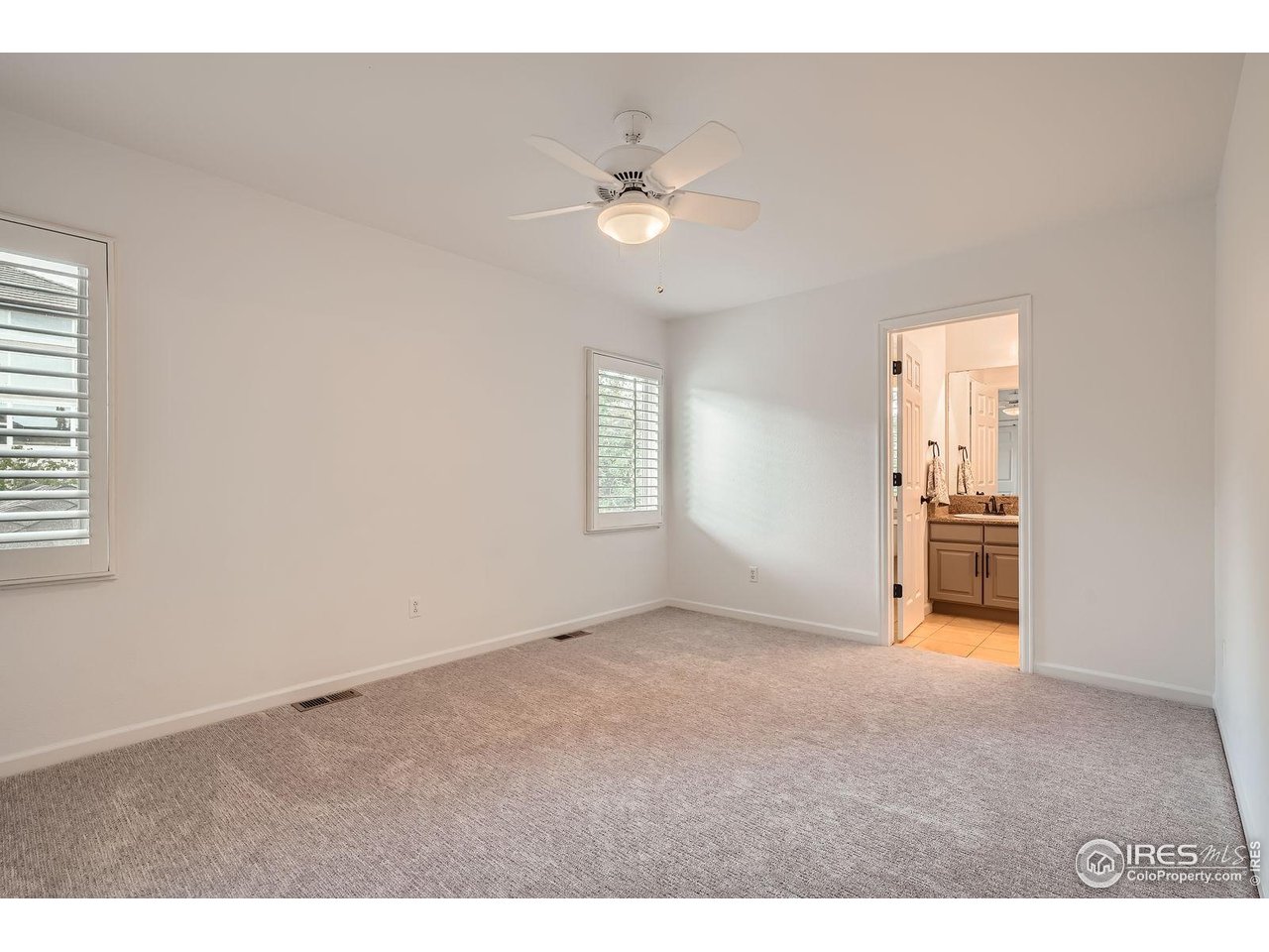 1069 Monarch Way Superior, CO 80027 - Photo 25 of 40 a view of a livingroom with a ceiling fan and window