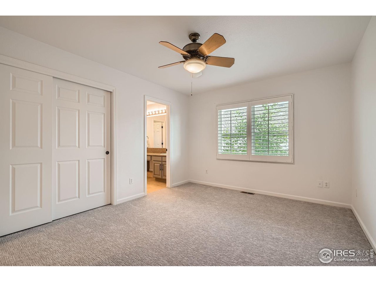 1069 Monarch Way Superior, CO 80027 - Photo 28 of 40 a view of an empty room and a ceiling fan