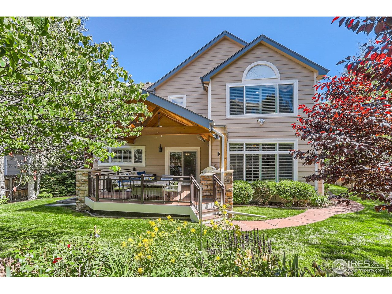 1069 Monarch Way Superior, CO 80027 - Photo 36 of 40 a front view of a house with a yard