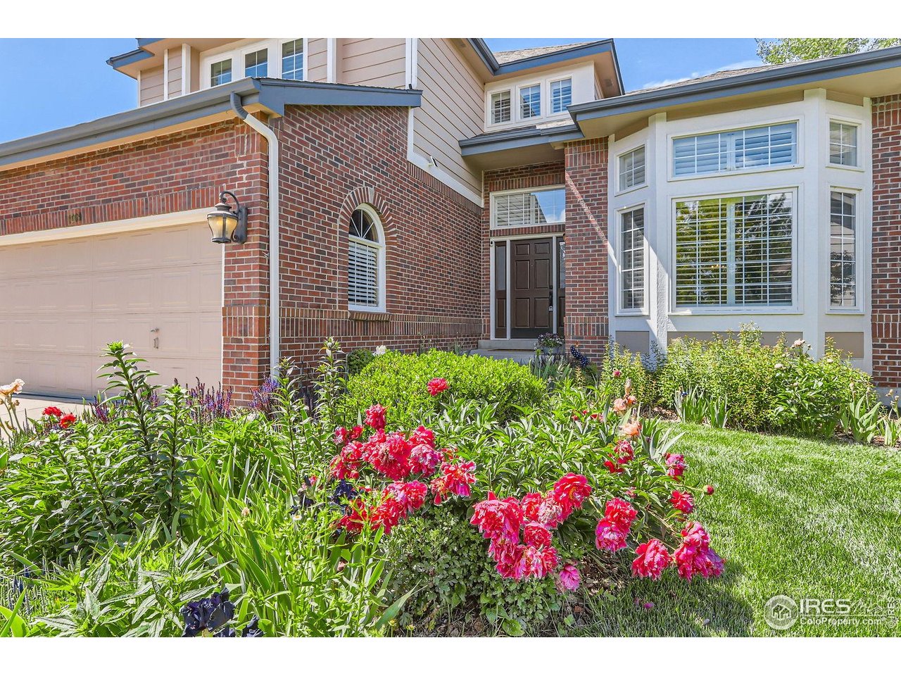 1069 Monarch Way Superior, CO 80027 - Photo 4 of 40 a view of a house with many windows