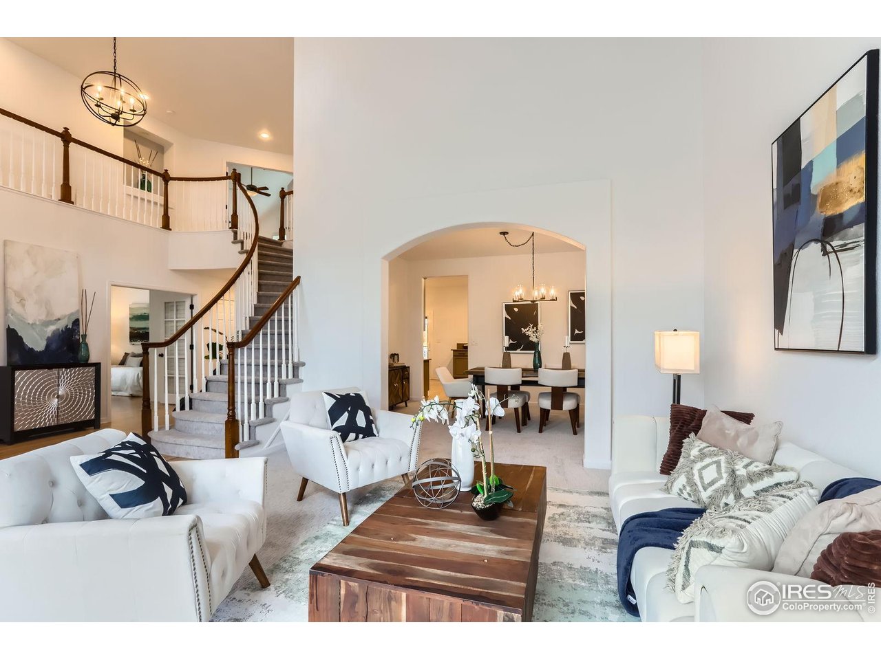 1069 Monarch Way Superior, CO 80027 - Photo 7 of 40 a living room with furniture and a chandelier