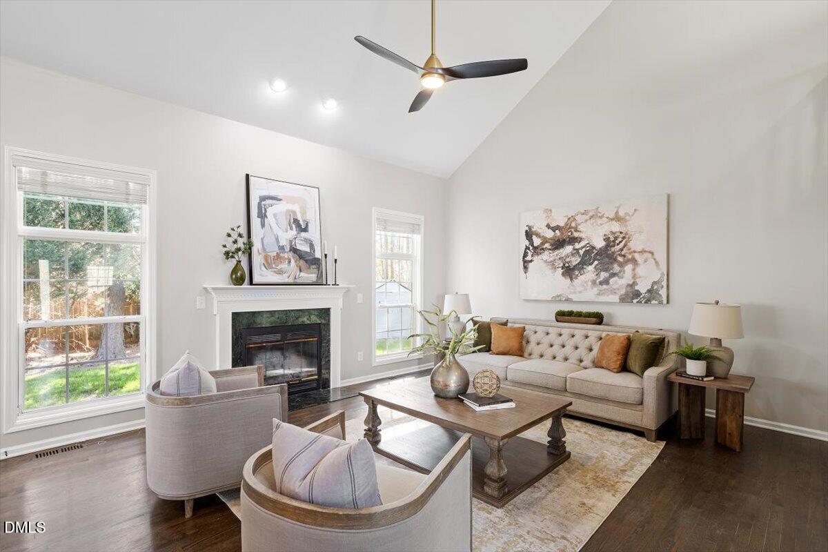 327 Whitney Lane Durham, NC 27713 - Photo 12 of 33 a living room with furniture a fireplace and a window