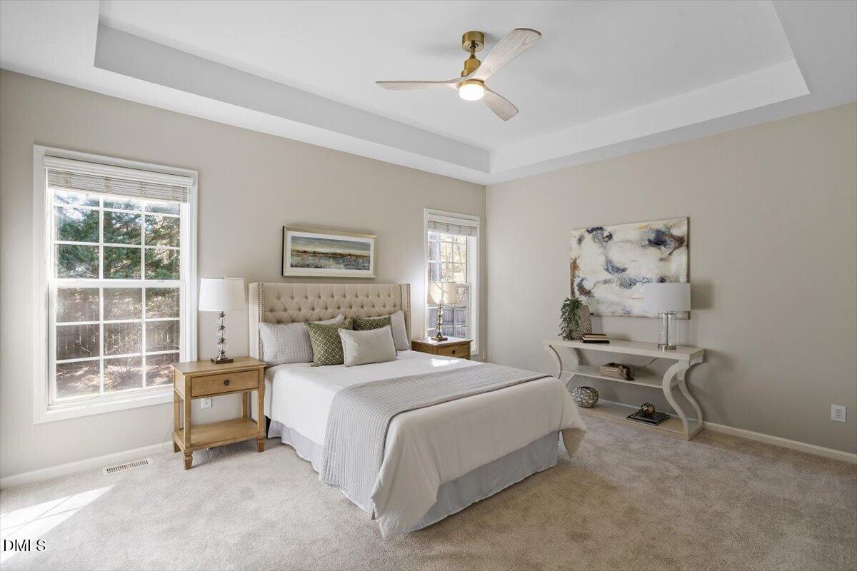 327 Whitney Lane Durham, NC 27713 - Photo 15 of 33 a bedroom with a large bed and a window