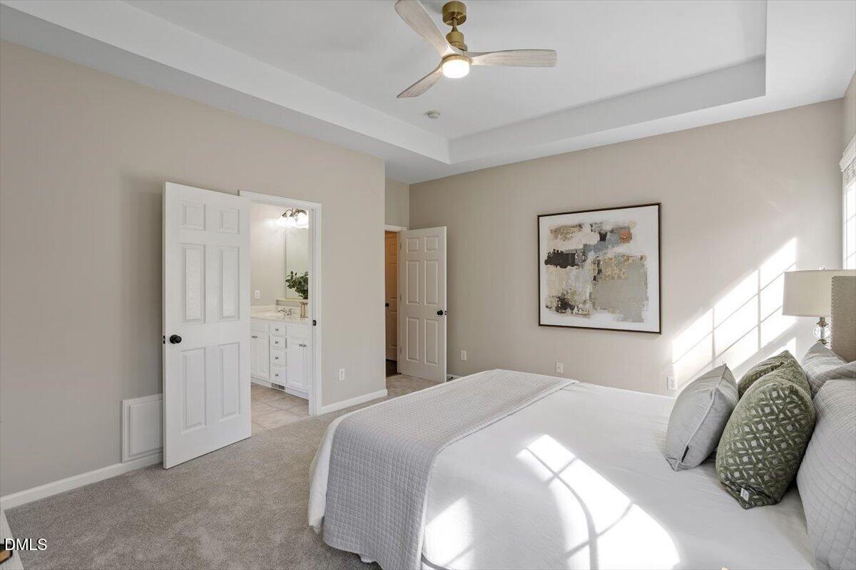 327 Whitney Lane Durham, NC 27713 - Photo 16 of 33 a bedroom with a bed and a painting on the wall
