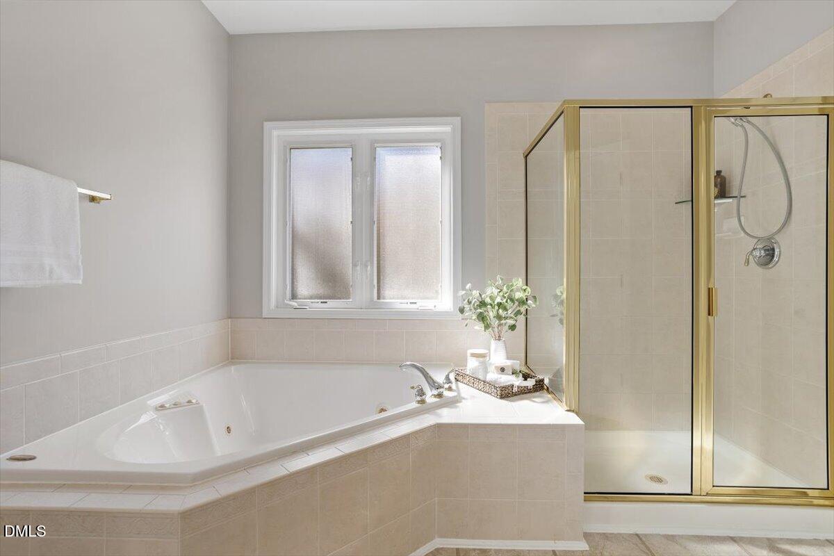 327 Whitney Lane Durham, NC 27713 - Photo 18 of 33 a white bath tub sitting next to a shower