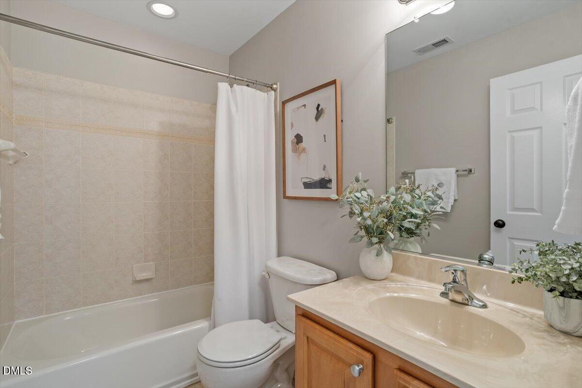 327 Whitney Lane Durham, NC 27713 - Photo 22 of 33 a bathroom with a sink toilet and shower