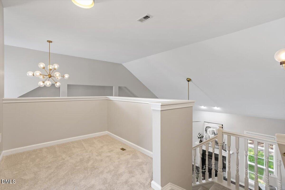 327 Whitney Lane Durham, NC 27713 - Photo 24 of 33 a view of a livingroom with a chandelier fan