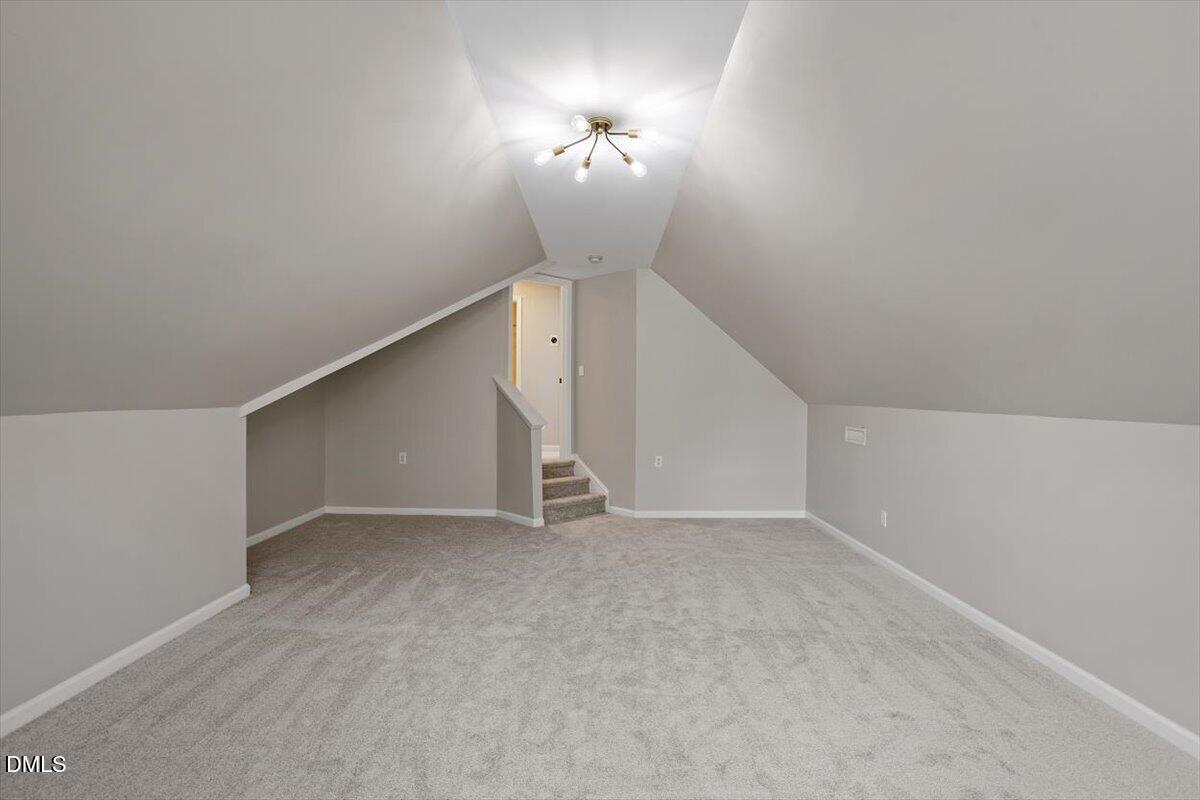 327 Whitney Lane Durham, NC 27713 - Photo 26 of 33 a view of an empty room with a ceiling fan