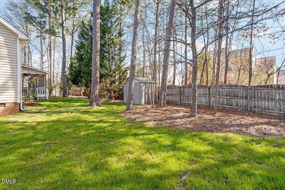 327 Whitney Lane Durham, NC 27713 - Photo 27 of 33 a view of a backyard with large trees