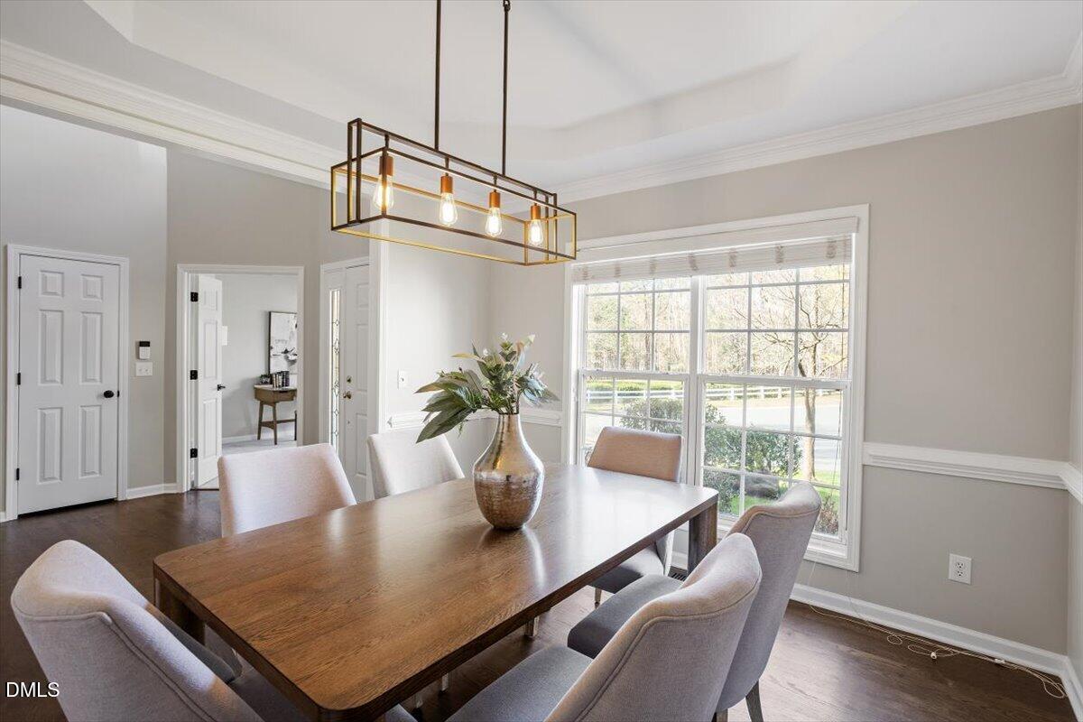 327 Whitney Lane Durham, NC 27713 - Photo 3 of 33 a view of a dining room with furniture window and wooden floor