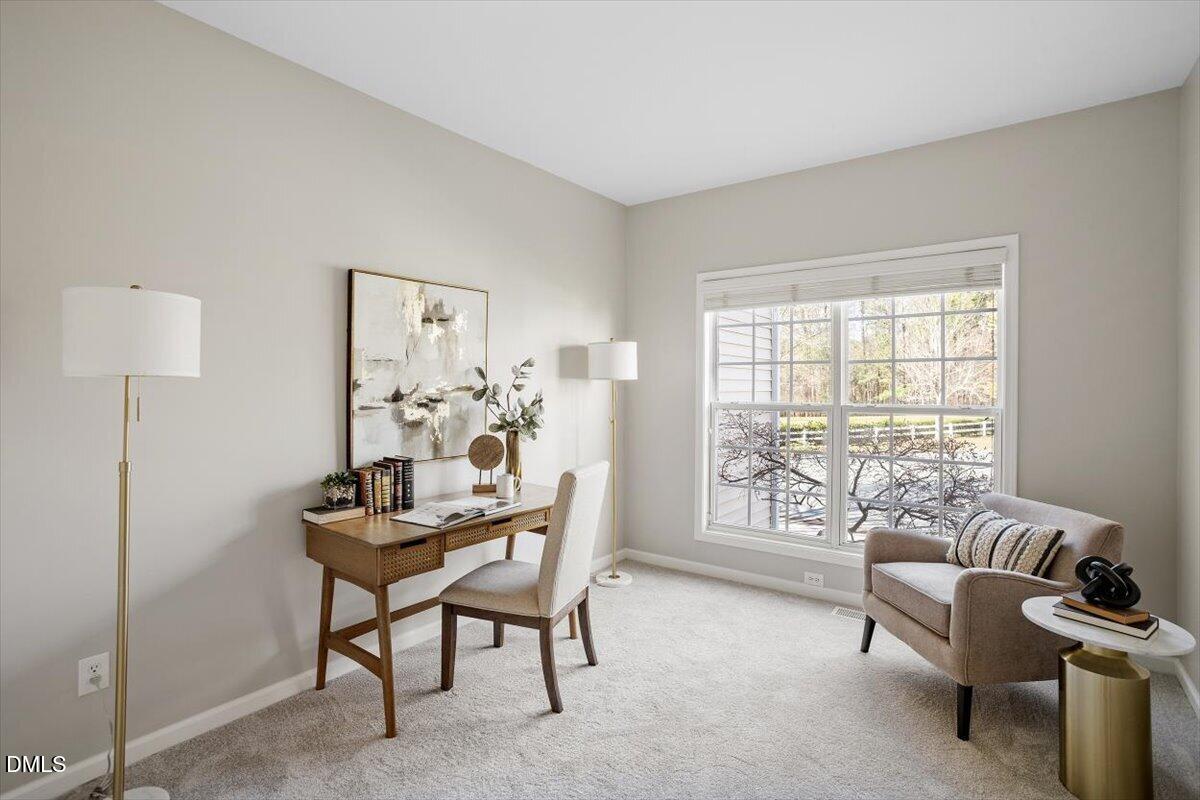 327 Whitney Lane Durham, NC 27713 - Photo 4 of 33 a view of a livingroom with furniture and a window