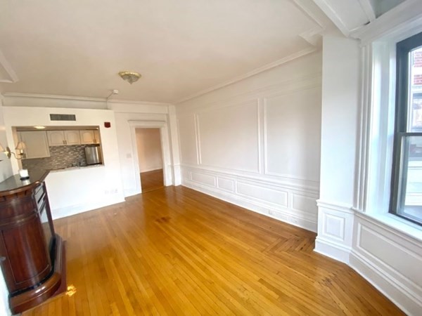 466 Commonwealth Avenue, Unit 302 Boston, MA 02215 - Photo 6 of 12 a view of a living room hardwood and kitchen