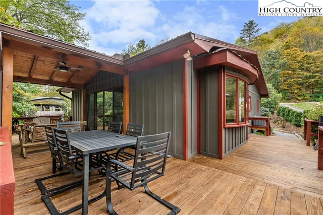 a view of a dinning table and chairs in patio of the house