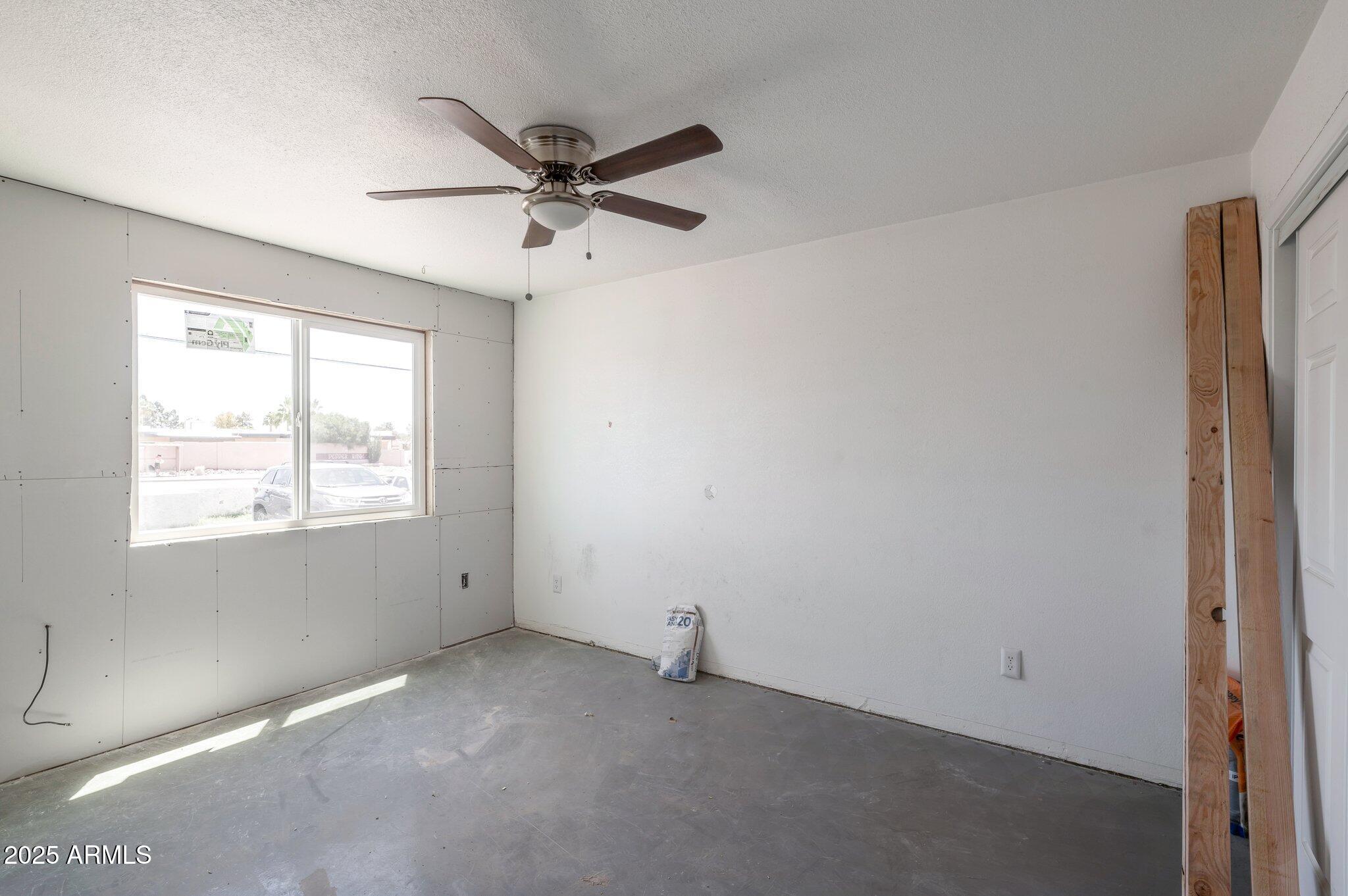 18202 Cave Creek Road, Unit 129 Phoenix, AZ 85032 - Photo 3 of 9 a view of an empty room with a window