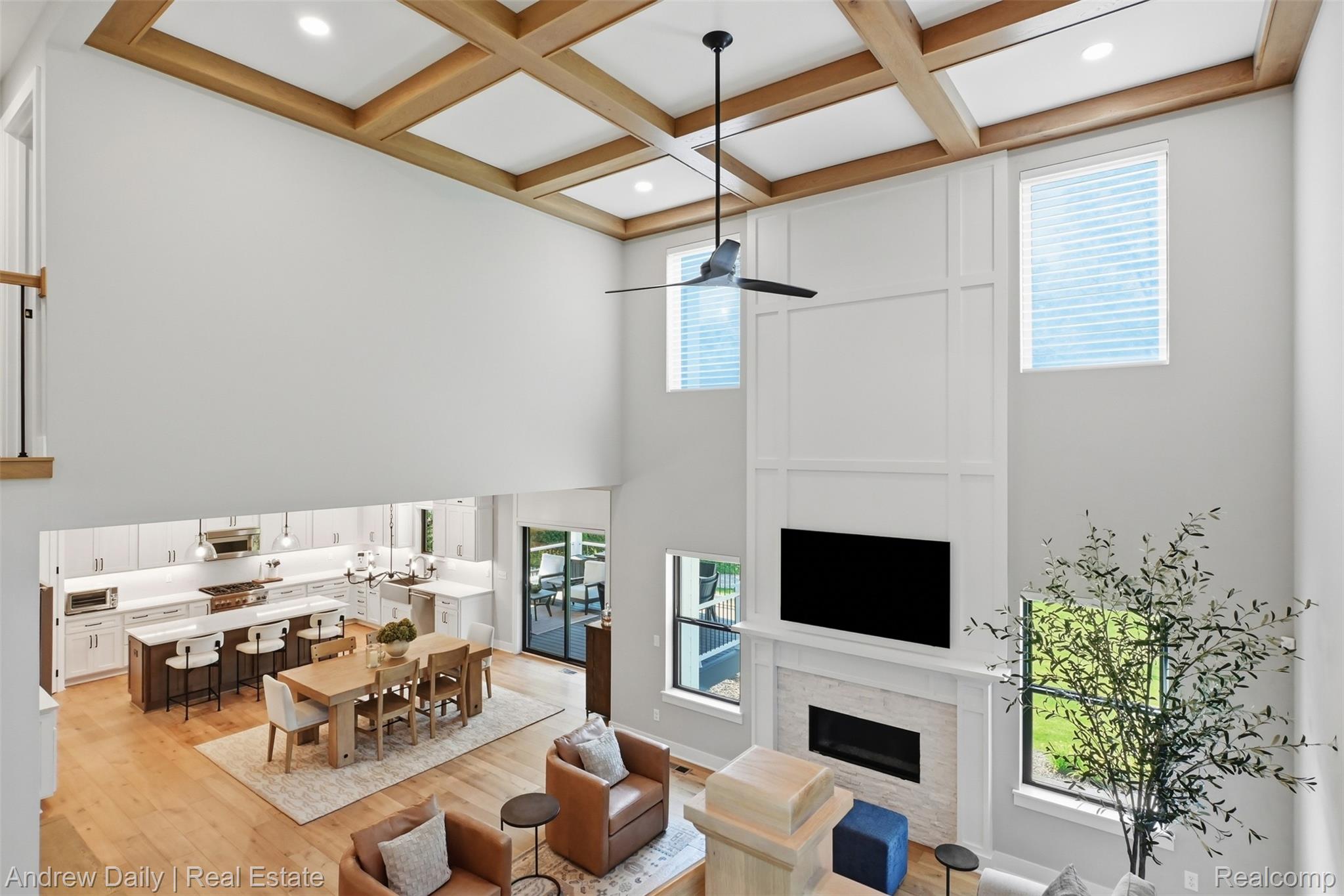4661 Spears Road Pinckney, MI 48169 - Photo 16 of 56 Two-story living area featuring a decorative coffered ceiling with recessed lighting