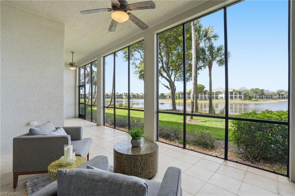 9263 Museo Circle, Unit 103 Naples, FL 34114 - Photo 1 of 49 Sunroom featuring a ceiling fan and a water view