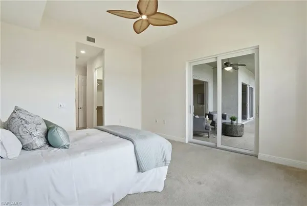 a bathroom with a sink a toilet and shower curtain