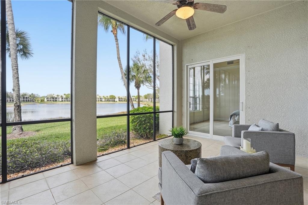 9263 Museo Circle, Unit 103 Naples, FL 34114 - Photo 32 of 49 Sunroom featuring a ceiling fan and a water view