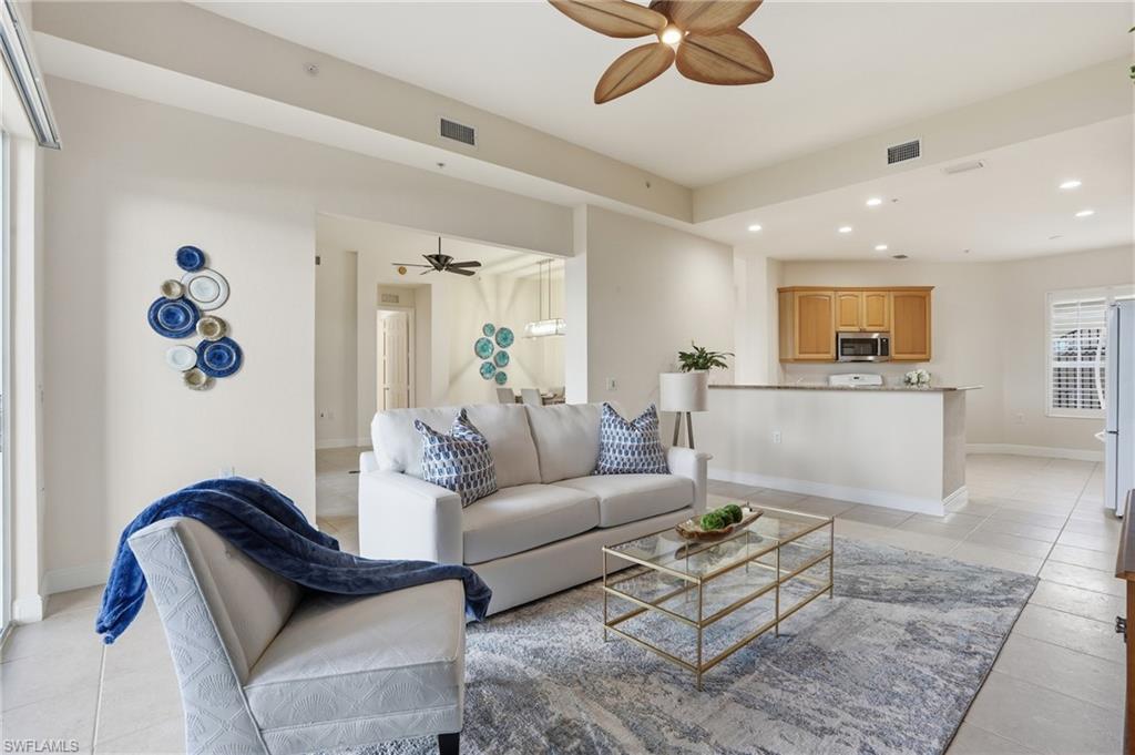 9263 Museo Circle, Unit 103 Naples, FL 34114 - Photo 4 of 49 Living area with recessed lighting, ceiling fan, and light tile patterned floors
