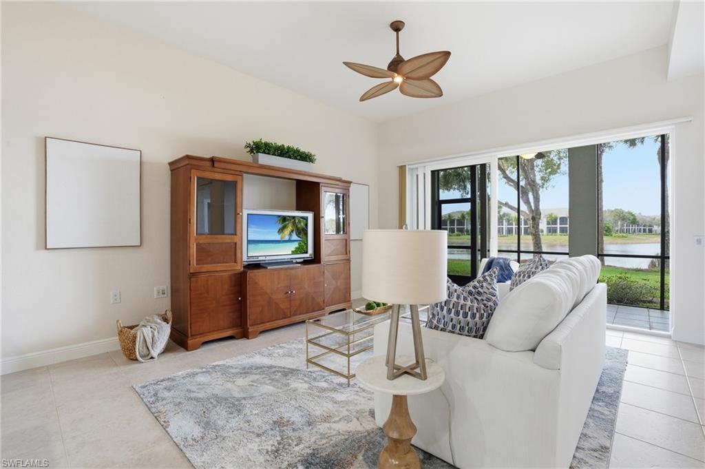 9263 Museo Circle, Unit 103 Naples, FL 34114 - Photo 5 of 49 Living room featuring a ceiling fan and baseboards