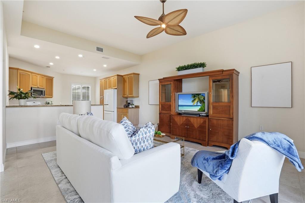 9263 Museo Circle, Unit 103 Naples, FL 34114 - Photo 6 of 49 Living room featuring light tile patterned flooring, recessed lighting, and ceiling fan