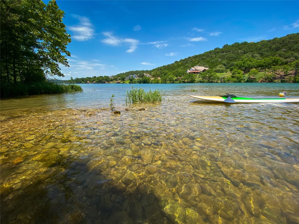 14013 Running Deer Trail Austin, TX 78734 - Photo 11 of 22 a view of a lake with houses in the background