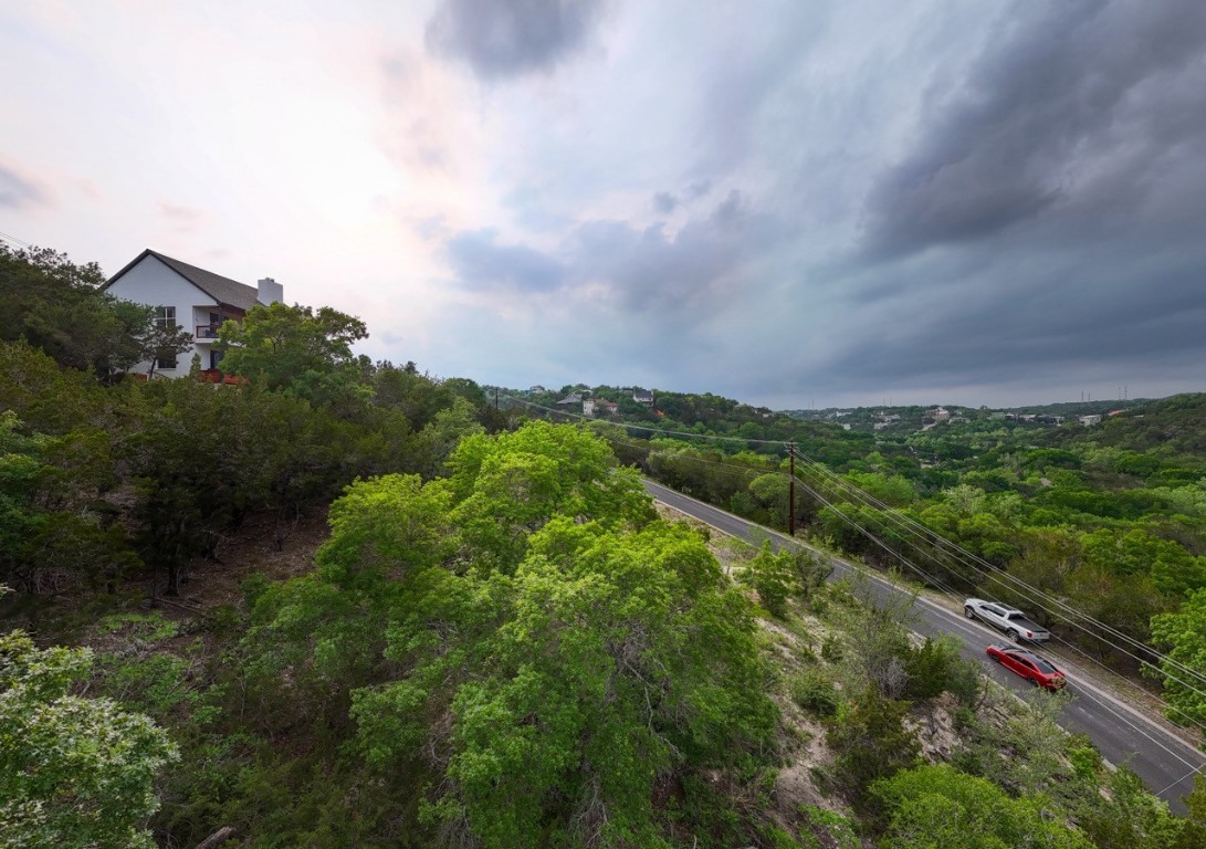 14013 Running Deer Trail Austin, TX 78734 - Photo 19 of 22 a view of a city with lush green forest