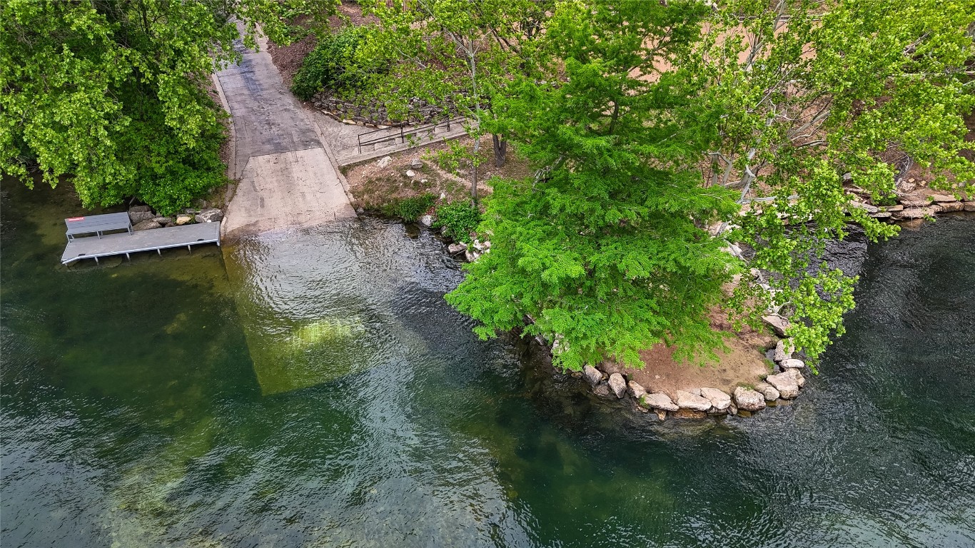 14013 Running Deer Trail Austin, TX 78734 - Photo 5 of 22 a backyard of a house with a yard with outdoor seating and green space