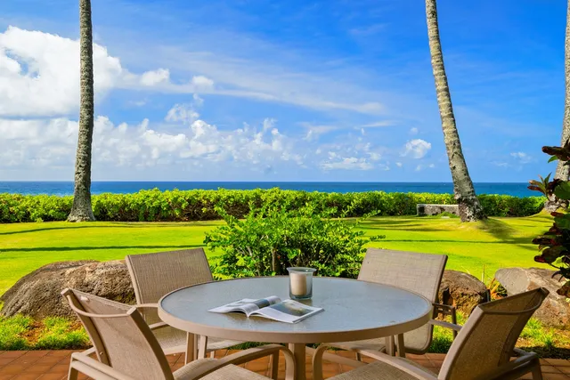 a view of a chairs and table in patio