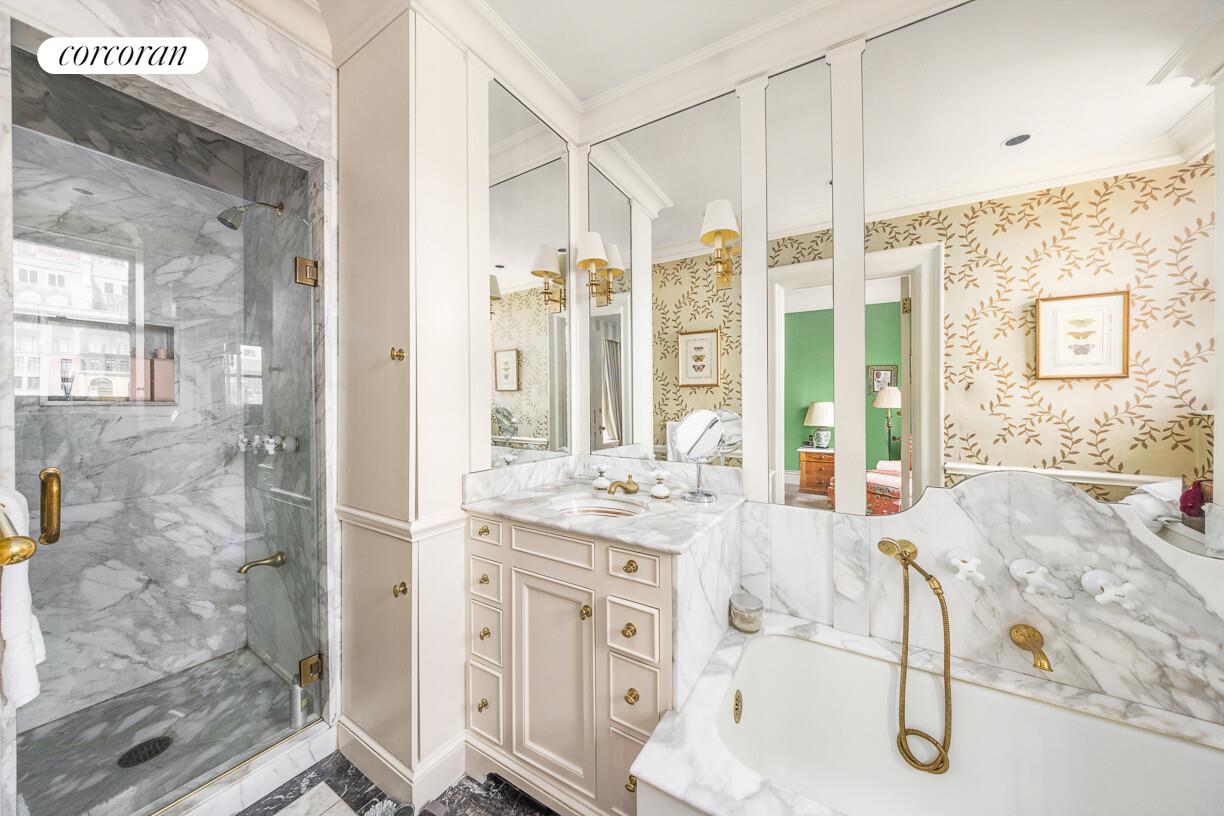 875 Park Avenue, Unit 8D9D Manhattan, NY 10075 - Photo 14 of 26 a spacious bathroom with sinks granite countertop tub shower and mirror