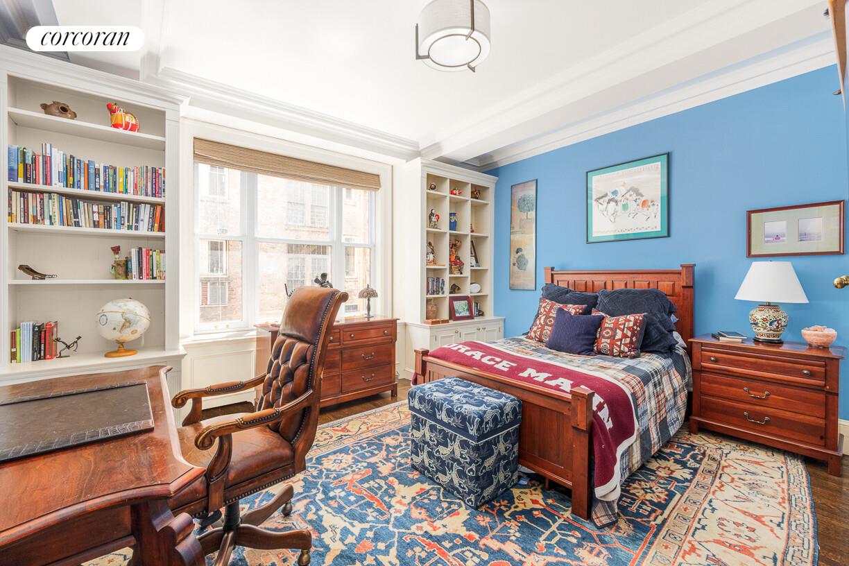 875 Park Avenue, Unit 8D9D Manhattan, NY 10075 - Photo 17 of 26 a bedroom with a bed and a bookshelf