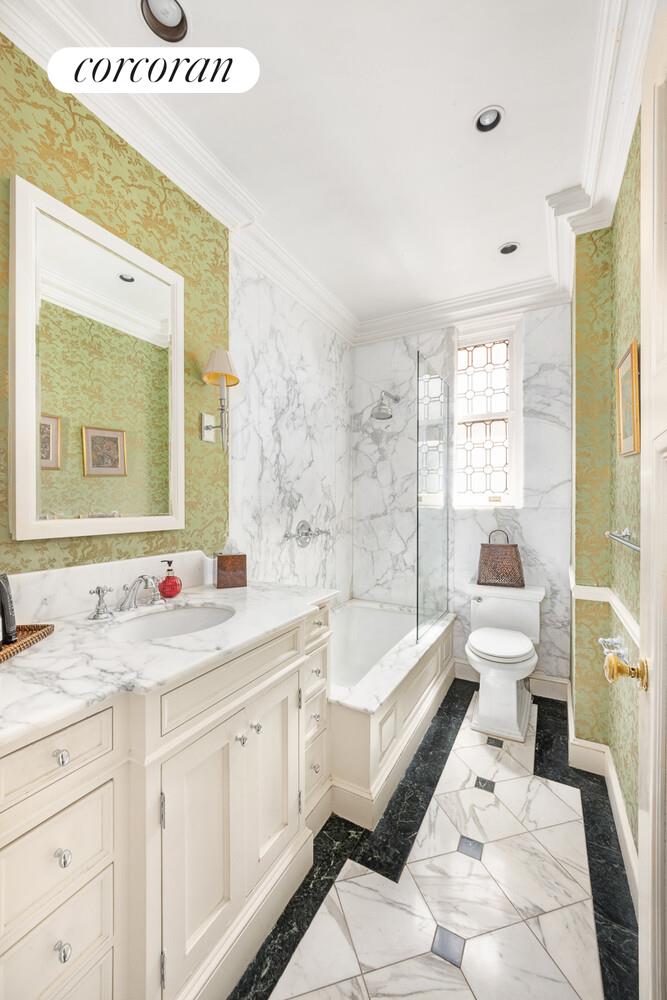 875 Park Avenue, Unit 8D9D Manhattan, NY 10075 - Photo 21 of 26 a bathroom with a granite countertop sink mirror vanity bathtub and a toilet