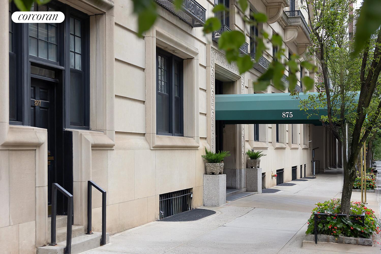875 Park Avenue, Unit 8D9D Manhattan, NY 10075 - Photo 22 of 26 a front view of a house with yard and parking